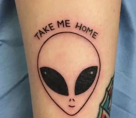 Alien face tattoo