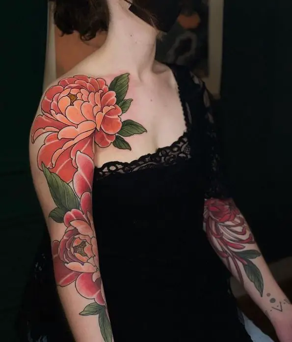 Colourful floral tattoo on the shoulder and arms