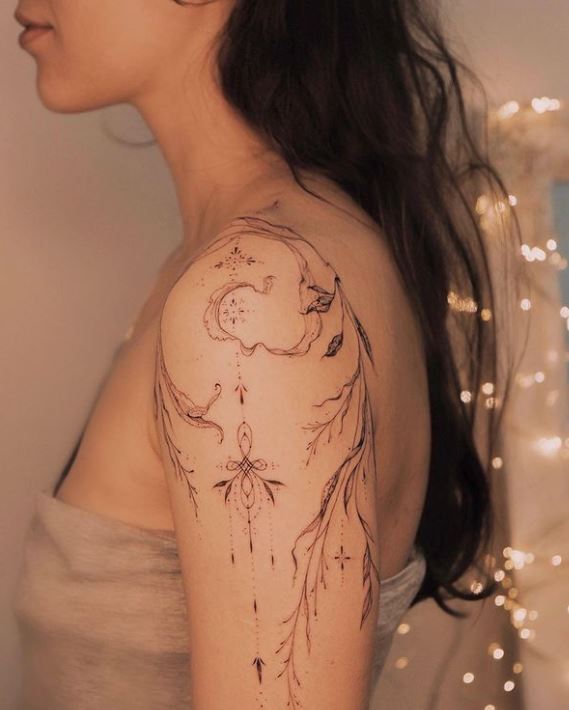 abstract shoulder jewellery tattoo