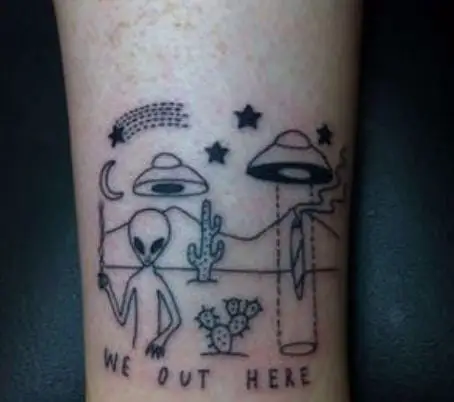 alien and spaceships in a desert tattoo
