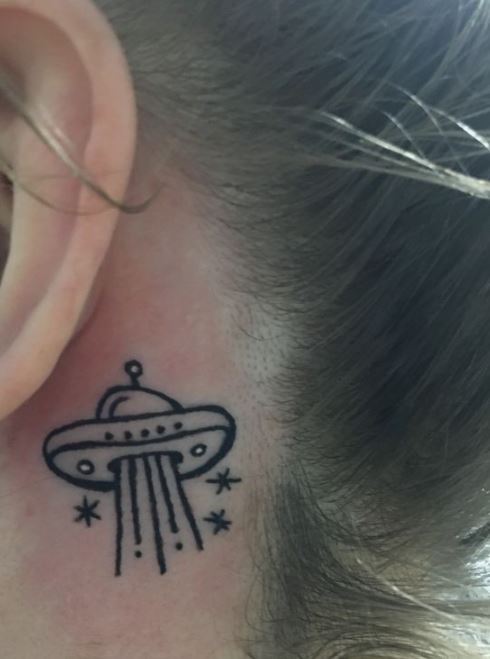 alien tattoo behind the ear