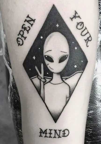 alien tattoo with the wording 'open your mind'