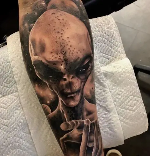 black sci-fi alien tattoo