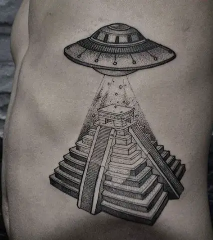 detailed tattoo of a pyramid and spaceship