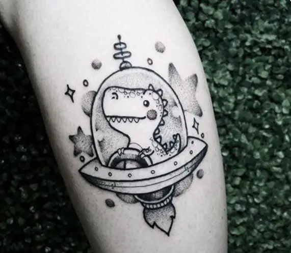 dinosaur on a spaceship tattoo