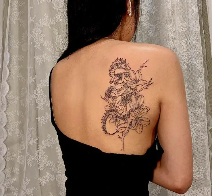 dragon and flowers shoulder tattoo