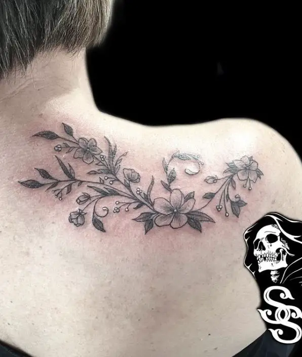horizontal floral shoulder tattoo