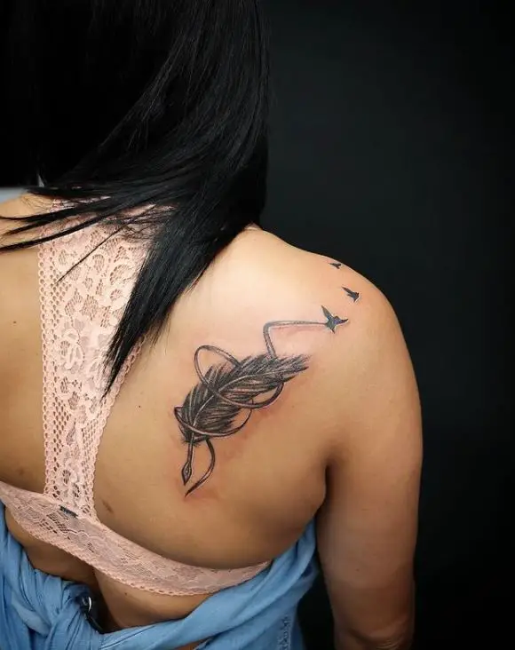 large feather and birds tattoo
