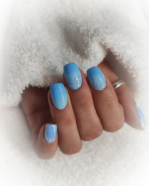 light blue ombre nails with glitter