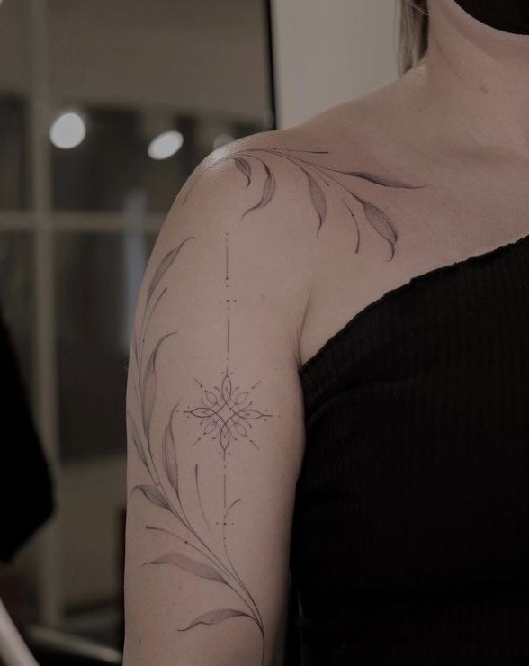 long leaf tattoo on the shoulder and hand