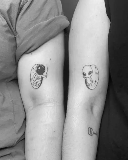 matching alien tattoos