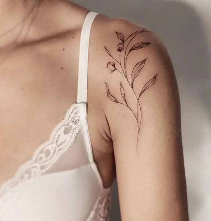 minimal shoulder tattoo with flowers