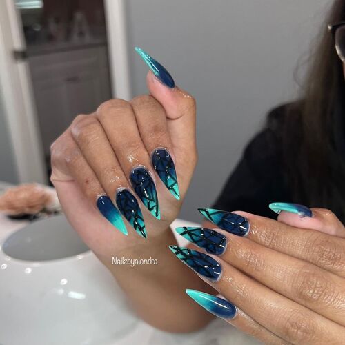 navy and electric blue ombre nail design with black geometric art