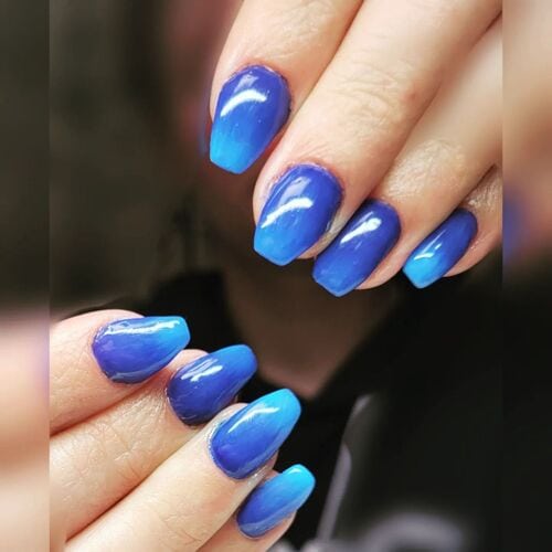 ombre nail art with 3 shades of blue