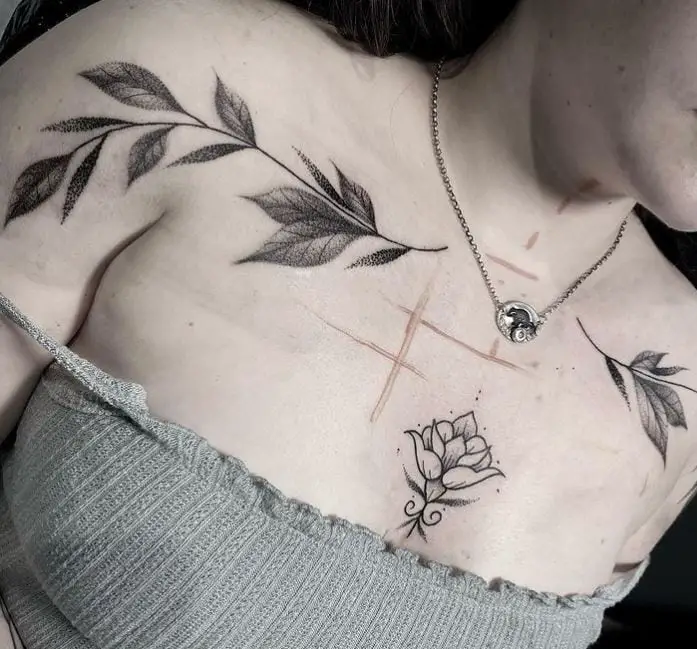 twin tattoos with leaf design