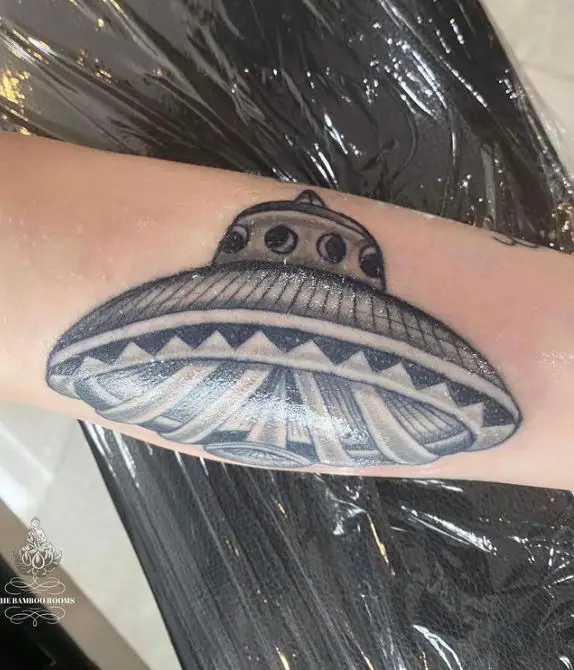ufo spaceship tattoo on the arm