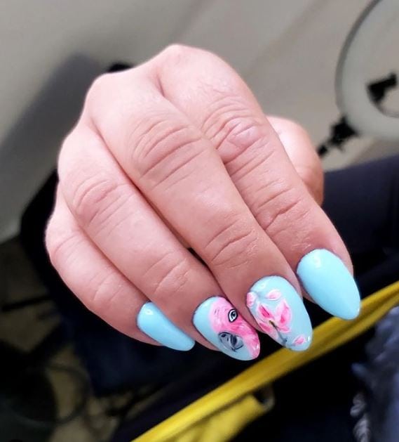Baby blue acrylic nails with a touch of pink