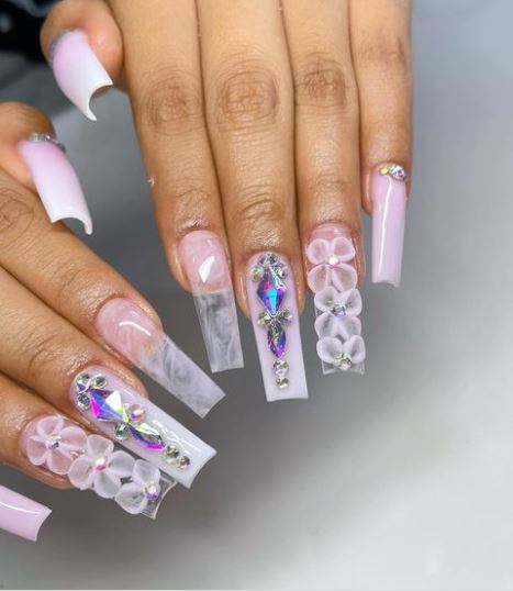 Baby pink nails with flowers and bling