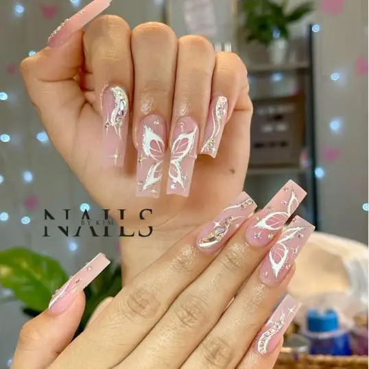 Combination of Nude and White Butterfly Nails