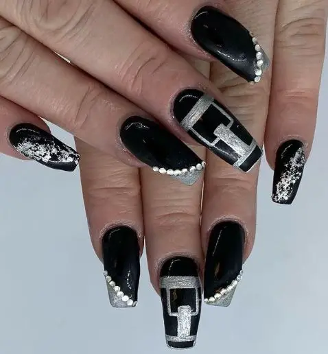 Creative black nails with silver patterns
