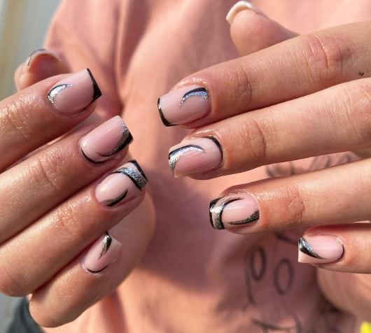 French manicure with wavy black and silver lines