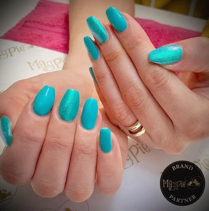 Turquoise acrylic nails on Stylevore