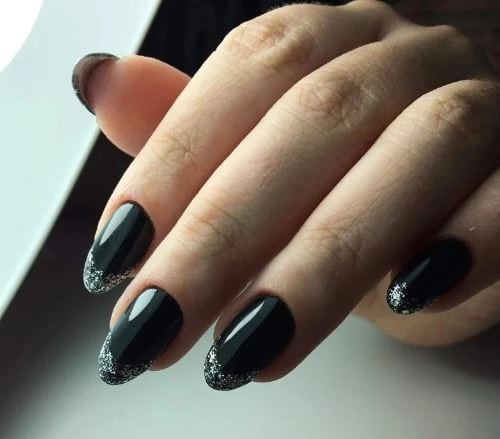 Nails with Black Polish and Silver Dust On Tips