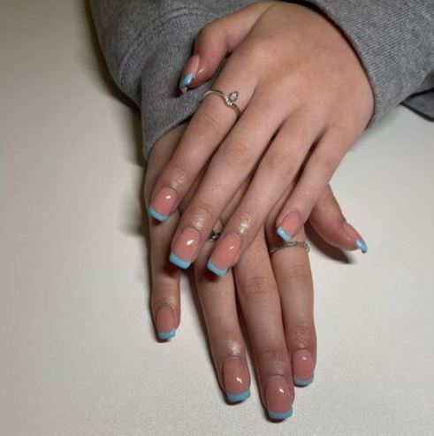 Nude nails with baby blue ombre tips