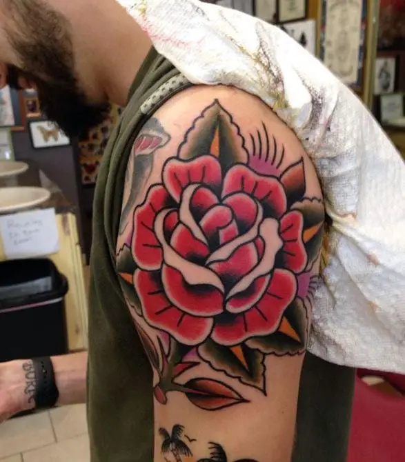Red Rose Shoulder Tattoo on a man
