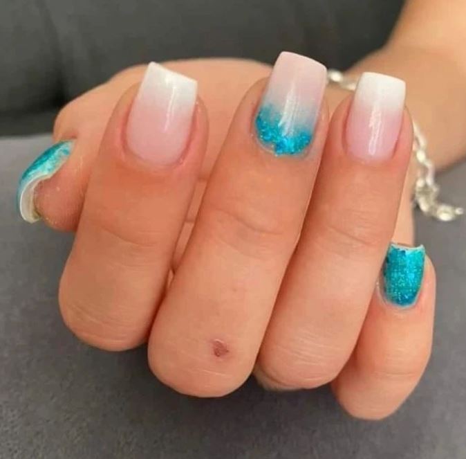 Blue Glitter Nail Polish on Nude Nails