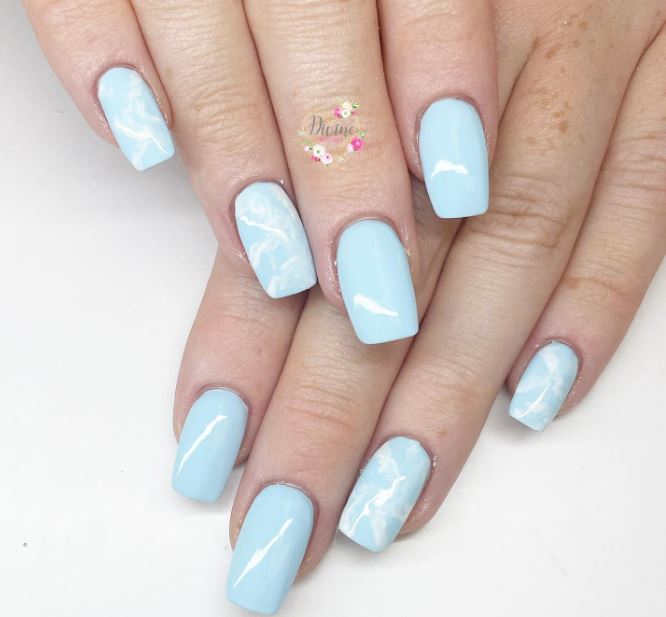 Simple blue manicure with clouds