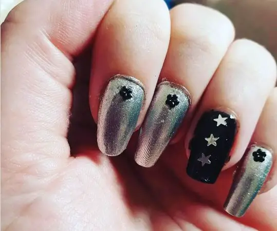 Sparkly silver nail art with nail gems