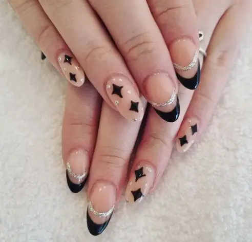 Stars and sparkles on nude nails 