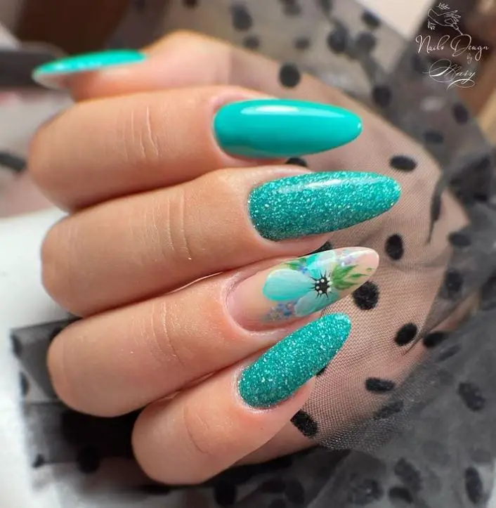 Turquoise Stiletto Nails With Floral Pattern