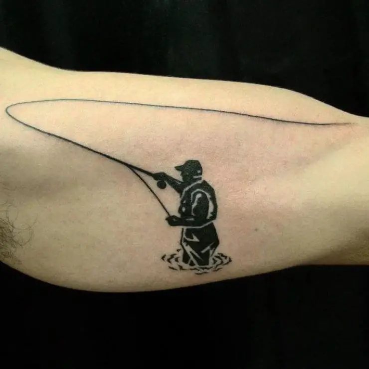 Tattoo of a silhouette of a fisherman and his fly fishing rod