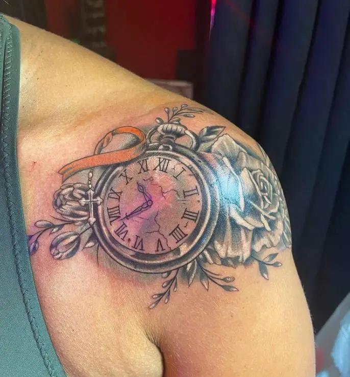 artistic tattoo of a clock and roses