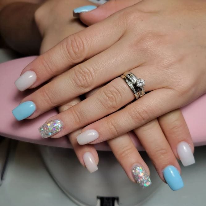 baby blue nails with glitter accent