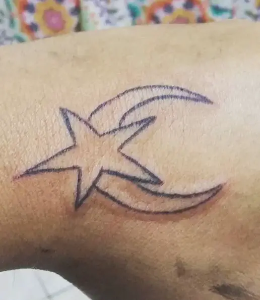 big moon and star hand tattoo