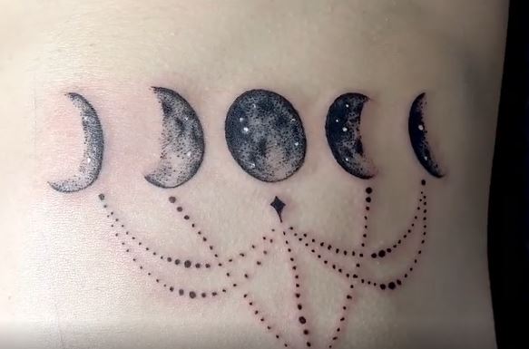 black and grey moon phase tattoo