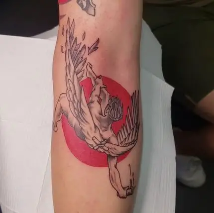 black and red icarus tattoo