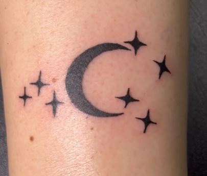 black filled moon and stars tattoo