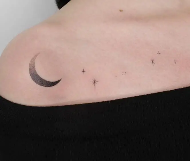black moon and stars tattoo on the shoulder