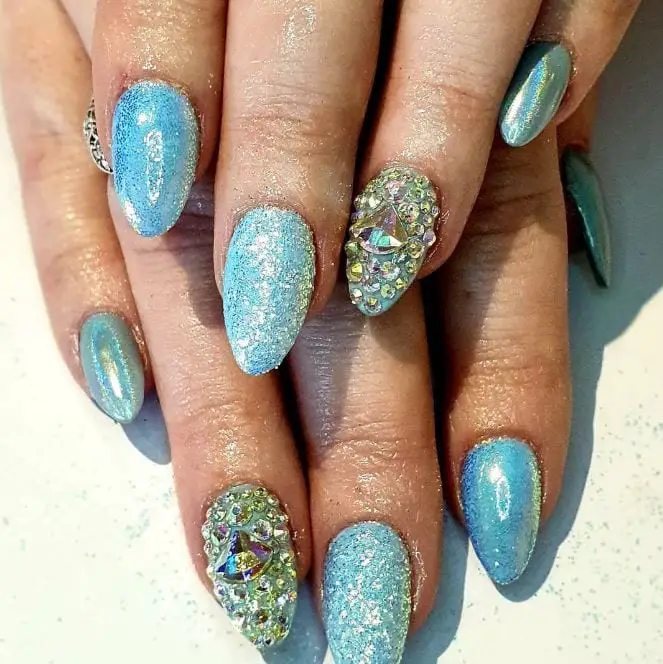 blue nails with glitter and rhinestones