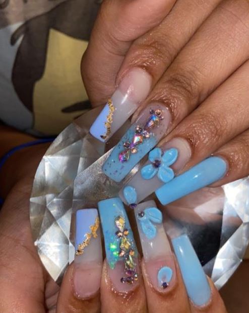 blue nails with stones, glitter and flowers