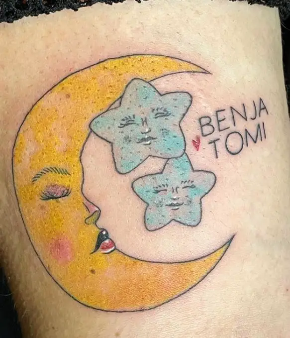 coloured cartoonish moon and stars tattoo