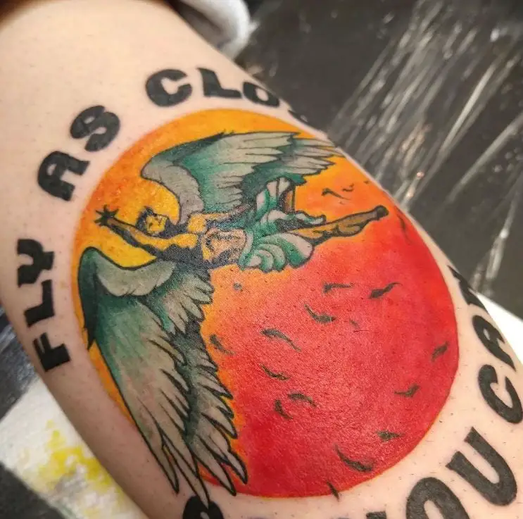 coloured icarus tattoo with a saying