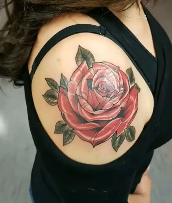 coloured rose tattoo on the shoulder cap