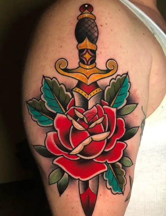 coloured tattoo with a dagger and a rose
