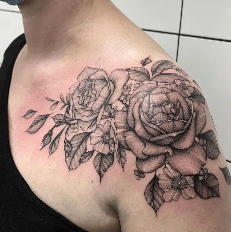 detailed black roses tattoo