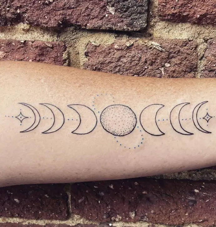 dot work moon phase tattoo